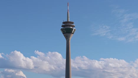 aerial view of the rhine tower against a clear blue sky in düsseldorf