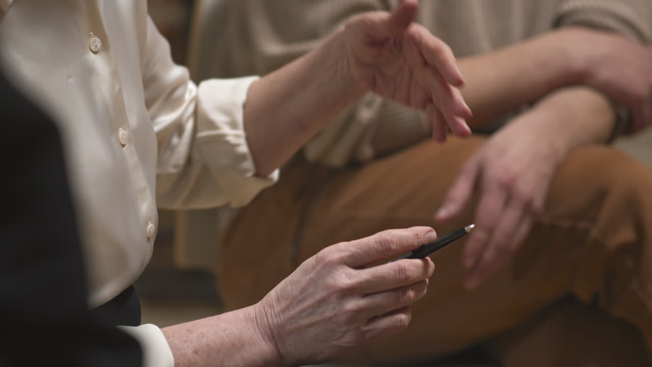 Female Psychologist Gesticulating during Therapy Session