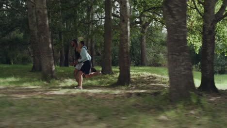 two fit athletes running and jogging in the park