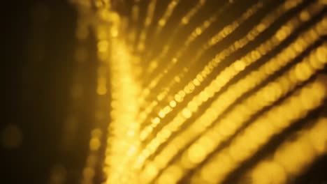 glittering golden textures are illuminated by soft light, showcasing intricate patterns and reflections. this mesmerizing display highlights the stunning details of the surface.
