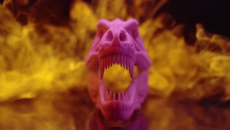 A-Purple-Colored-Animal-Skull-Is-In-Dark-Room-With-Flames-Behind-It