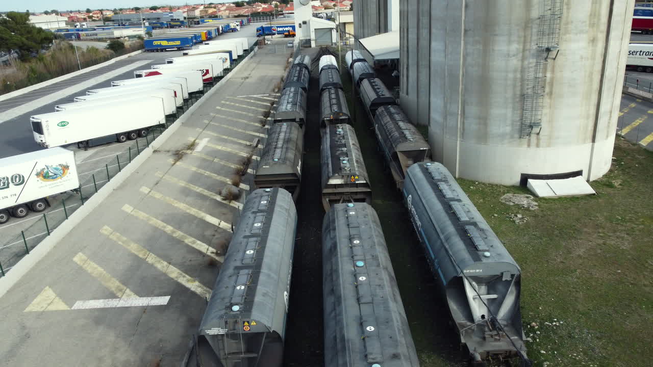 Industrial Area with Tank Cars and Trucks