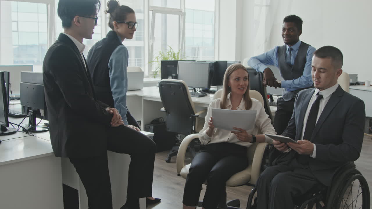Diverse Group of Businesspeople Having Meeting in Office