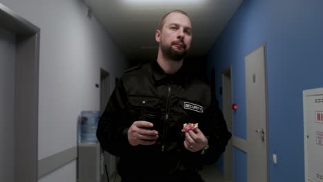 Man-in-uniform-relaxing-on-the-corridor