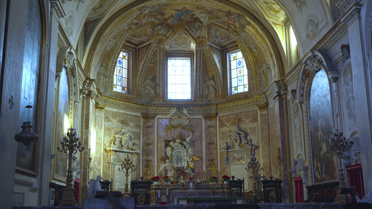 The beautiful ordained interior walls and dome of the Michael Angelo designed Catholic Basilica of Santa Maria degli Angeli e dei Martiri in Rome, Italy.
