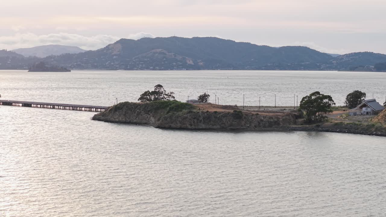Point Molate Beach stretches out below as a drone captures coastal textures and soft evening light.