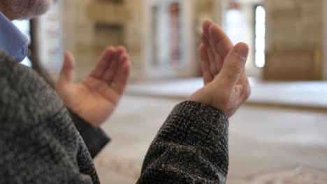 man praying with hands