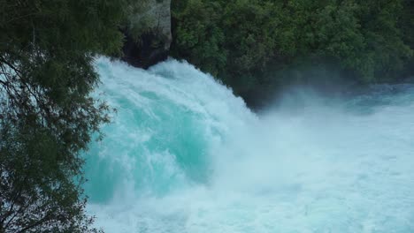 slowmo - close up pan of raging huka falls, new zealand