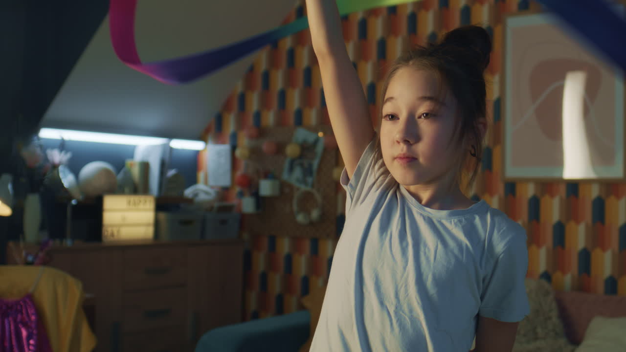 Girl practicing ribbon dancing at home