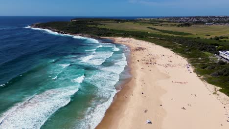 drone aerial landscape view surfing and waves sandy beach travel tourism coastline headland holiday destination maroubra beach randwick nsw sydney australia 4k