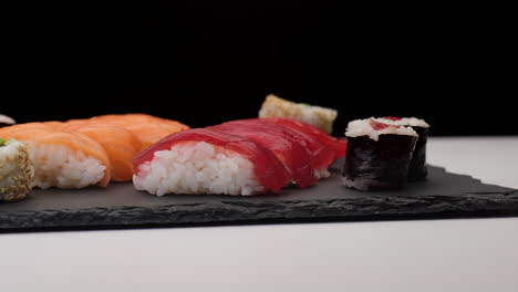 sushi assortment rotating on a plate