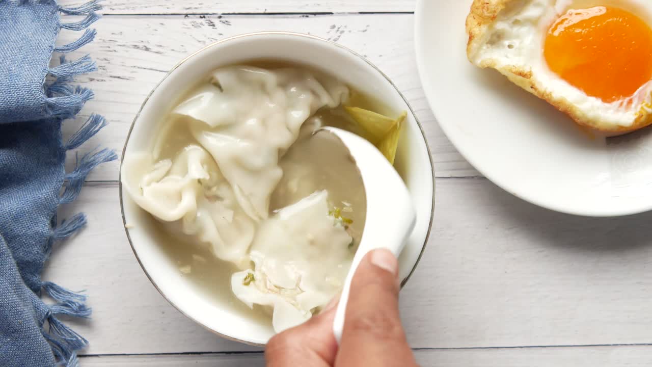 Delicious Soup with Dumplings and Fried Egg