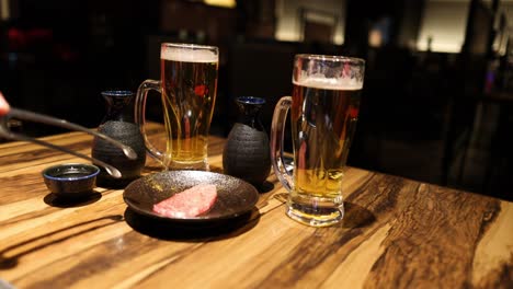 cooking steak on a hot stone at a restaurant