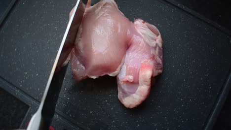 Short-video-cutting-up-a-piece-of-raw-chicken