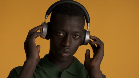 african american man on yellow background.