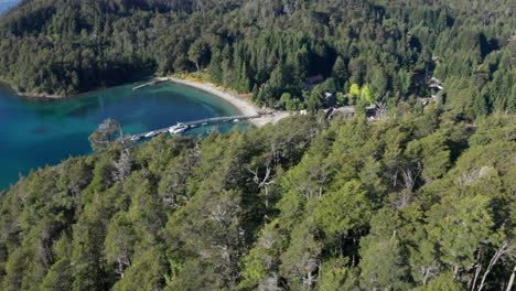 aerial - beautiful bahia brava bay, pier and forest, villa la angostura, neuquen, argentina