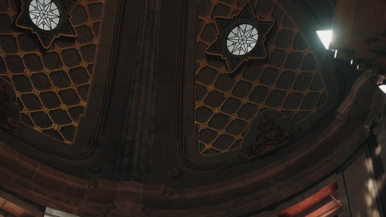 vivid stained glass windows brighten a stone church interior with colorful religious art