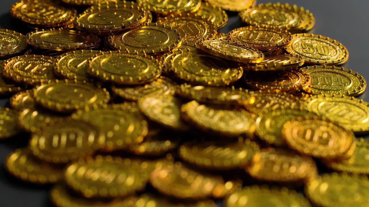 Golden Assets: A close-up stacks of gold coins representing wealth, financial prosperity success, savings, investment strategies, and financial security