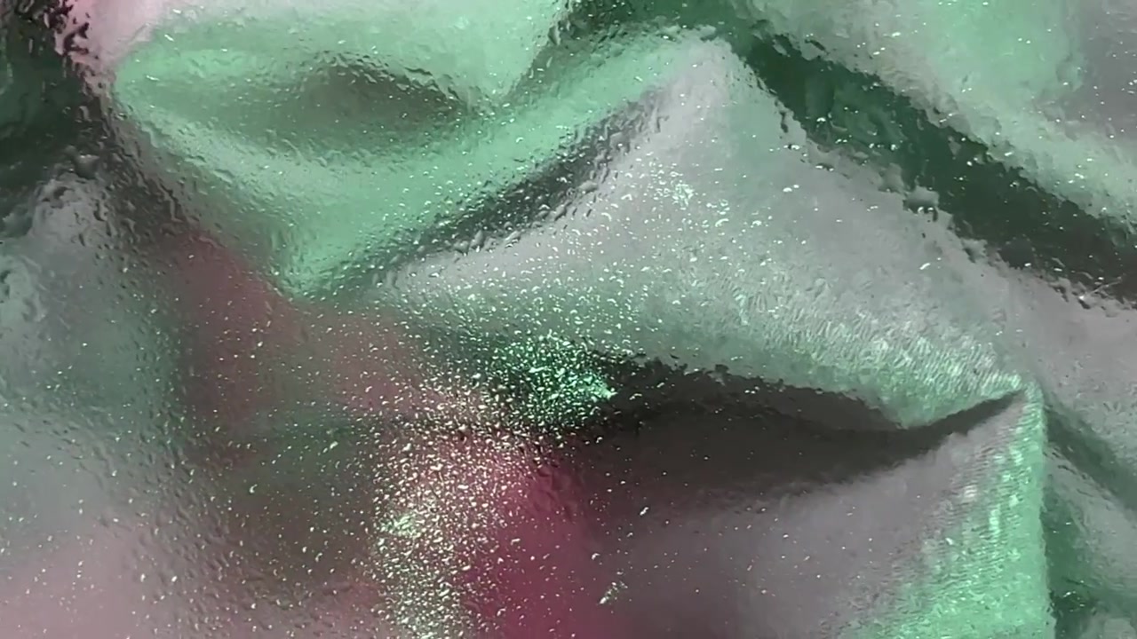 Abstract Background of Green and Pink Fabric Behind Frosted Glass