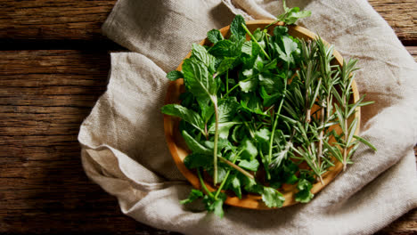 fresh herbs in wooden plate 4k