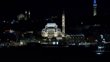 panoramic view of historic new mosque at night, istanbul, turkey