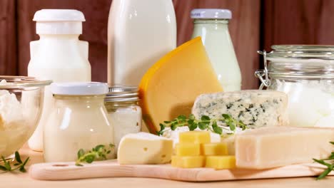 assorted dairy items arranged on a wooden surface