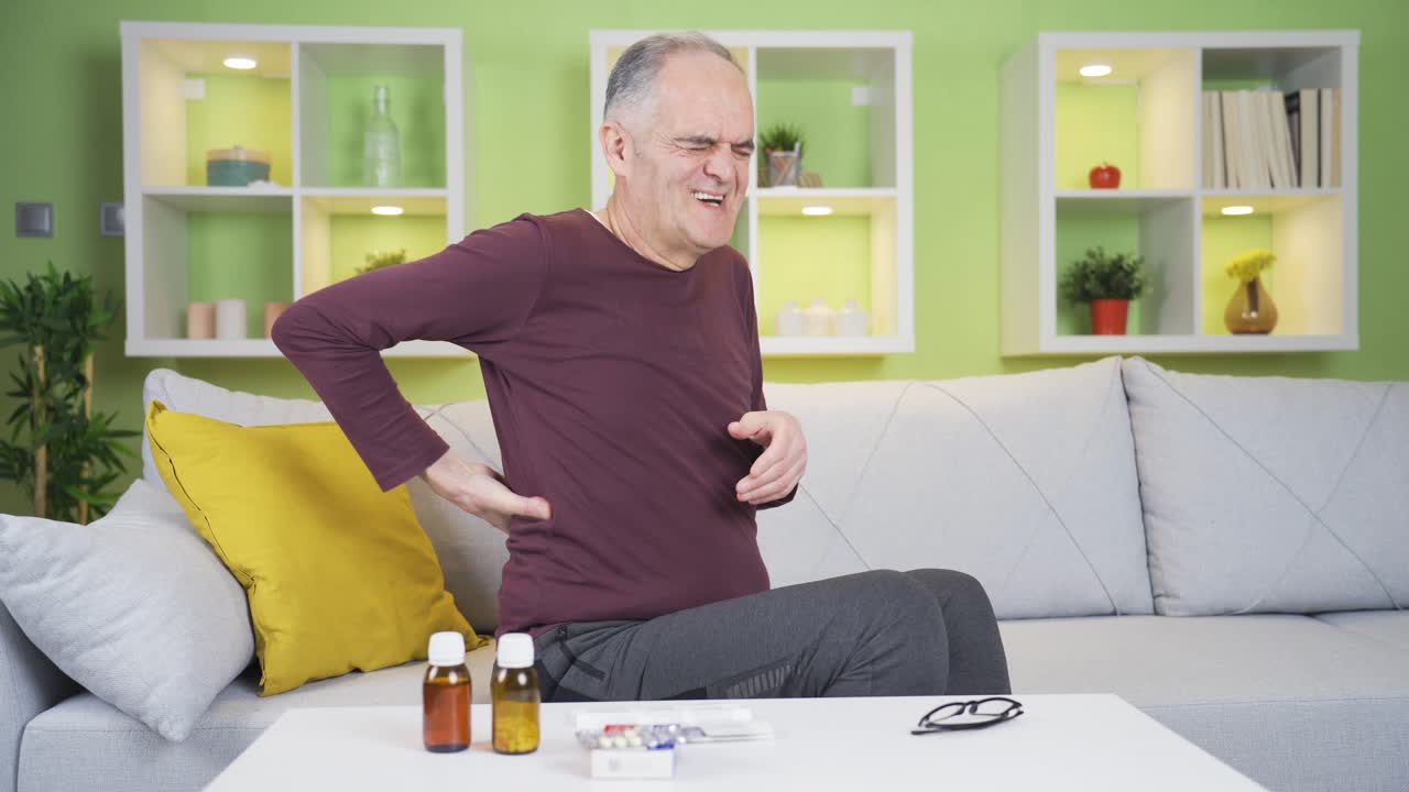 Old man with back pain.
