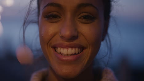 close-up-portrait-beautiful-young--holding-sparkler-celebrating-new-years-eve-birthday-party-smiling-enjoying-evening-celebration-slow-motion