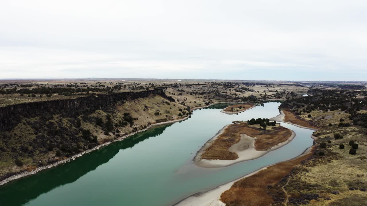 Drone shot of Idaho's Massacre Rocks along the Oregon Trail with the Snake River cutting through the land
