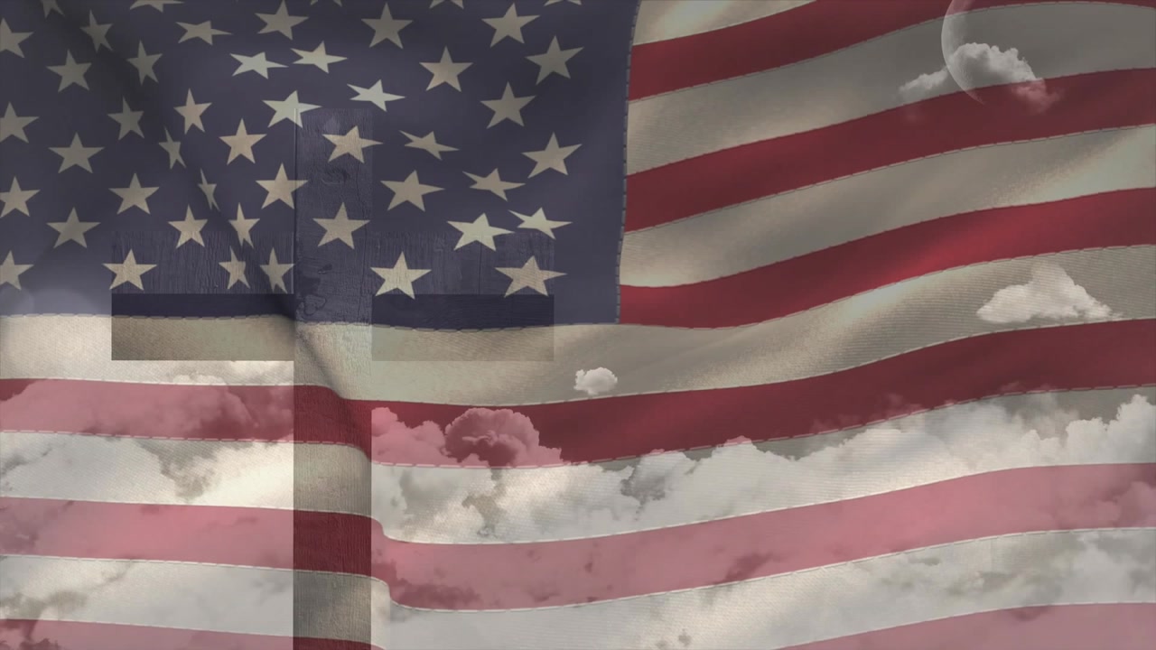 Loop starting, US flag rippling and folding while clouds drifting, cross overlay shifting for promo
