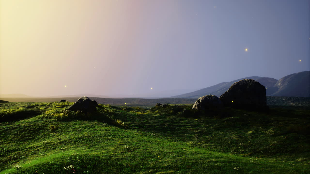 Vibrant sunset glow illuminating rolling hills and distant mountains in nature