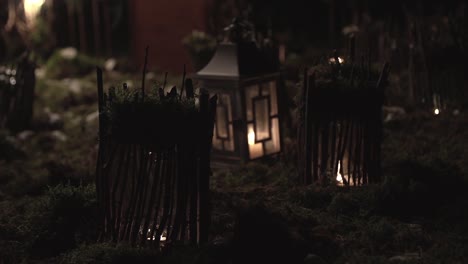 decorations for the holiday small houses in the grass illuminated by lamps at night