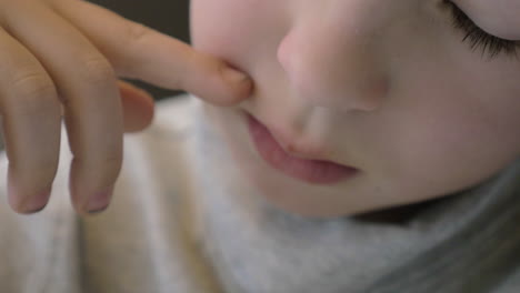 child sneezing close-up