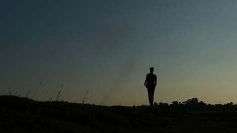 mans silhouette walking