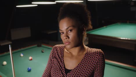 woman in pool hall
