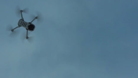 dji drone flys above in-flight slomo pan 2