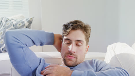 young man sleeping on sofa at home on a sunny day 4k 4k