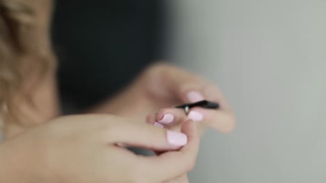 wedding earrings on a female hand. wedding earrings on a female hand, she takes the earrings, the bride fees, morning bride