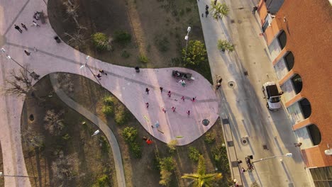 AERIAL---Dance-class-in-a-park-in-Palermo,-Buenos-Aires,-Argentina,-top-down-view