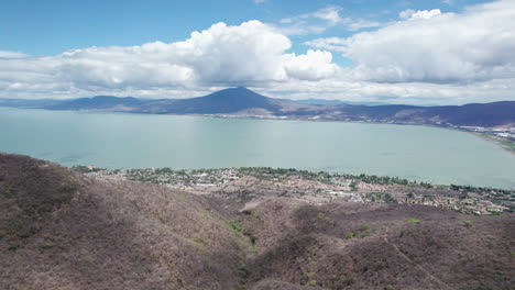 this compelling drone footage reveals a stunning aerial journey from the mountains to the vast, serene expanse of lake chapala in jalisco, mexico