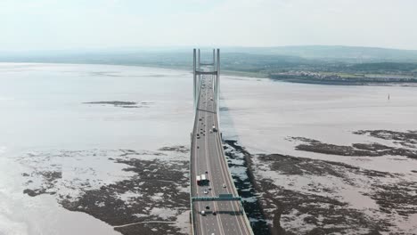 head on dolly back drone shot of prince of wales bridge severn estuary