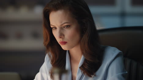 closeup businesswoman typing laptop keyboard at evening office. boss texting