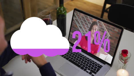 animation of cloud upload icon against rear view of man with drinks having a video call on laptop