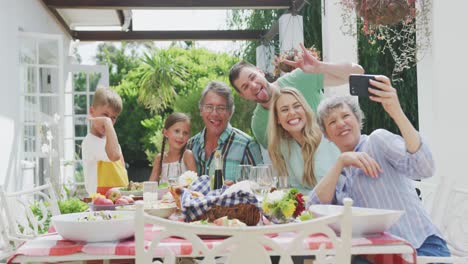 happy family eating together at table