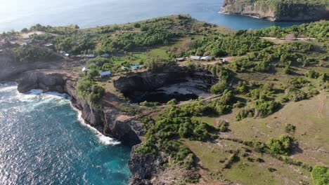 drone view of the coastal arch formation at broken beach, nusa penida, bali, indonesia