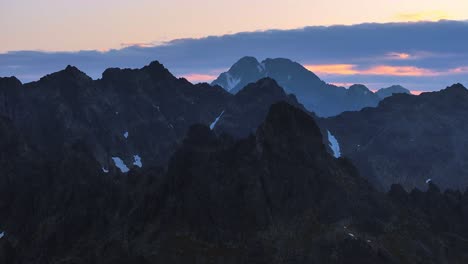 mountain-landscape-dynamic-slow-stable-drone-shot-at-sunrise-in-alpine-environment-and-sharp-ridges-6