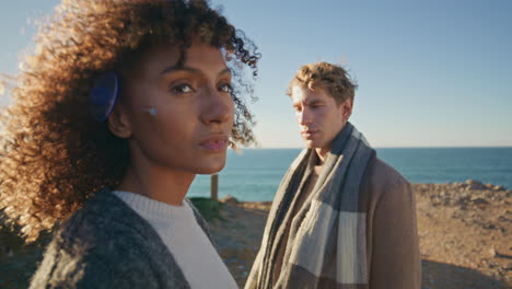 frustrated woman ignoring boyfriend at sea coast closeup. serious couple crisis