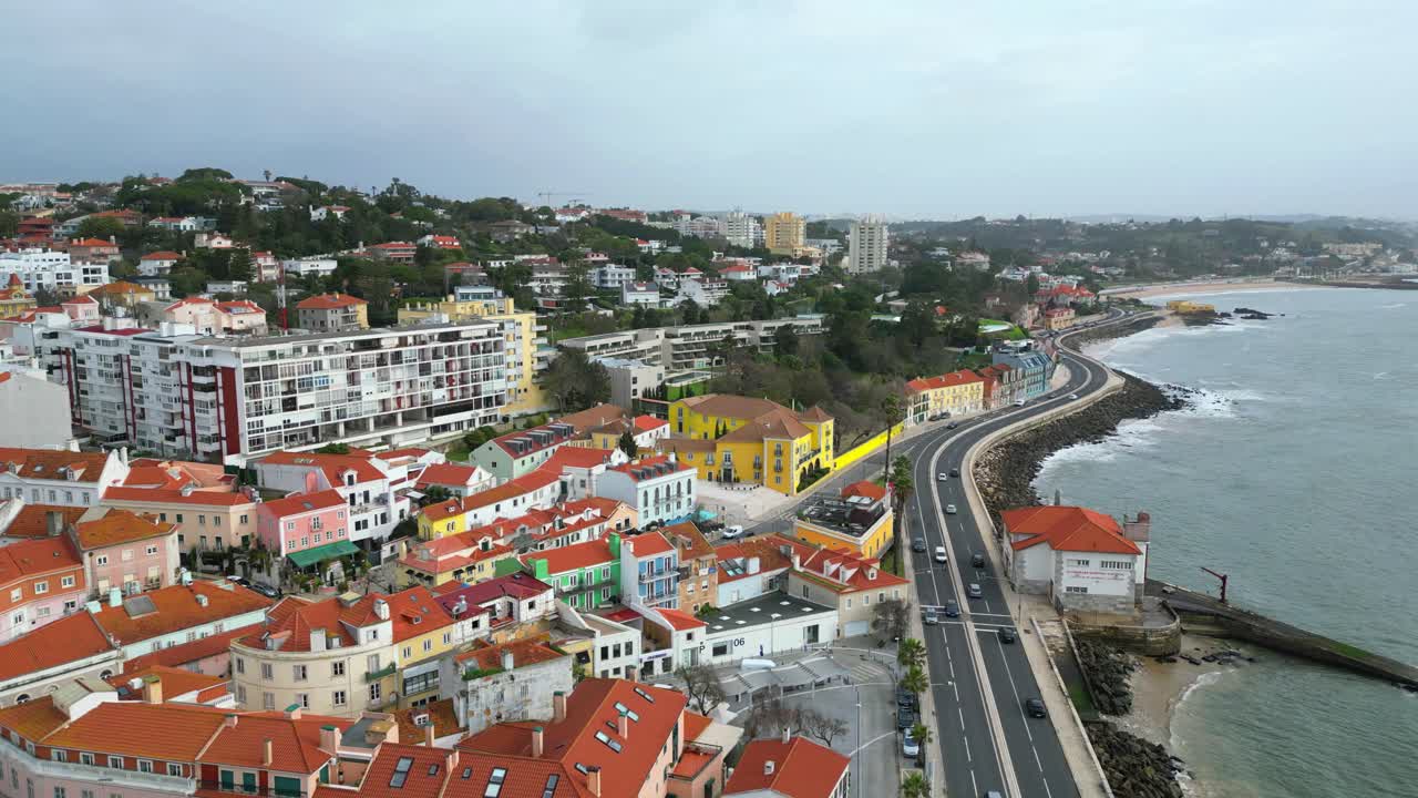 Aerial view at a cloudy day from the marginal and the Paço de Arcos village. Backwards drone shot. Oeiras,portugal