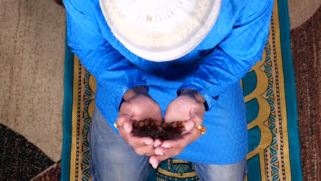 top view of man praying during ramadan, close up