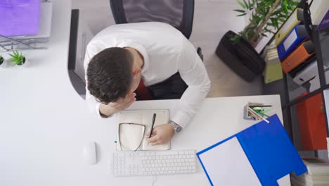 Businessman-falling-asleep-in-the-office.-Fatigue-and-insomnia.